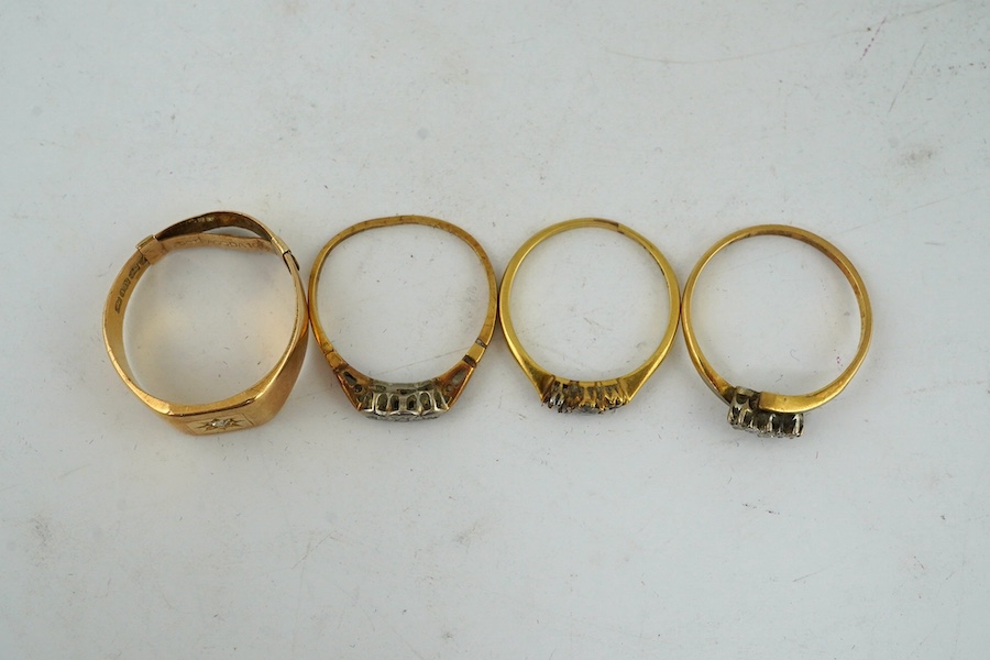 An 18ct gold and diamond chip set signet ring and three thin 18ct and diamond chip set rings, gross weight 11.5 grams. Condition - poor